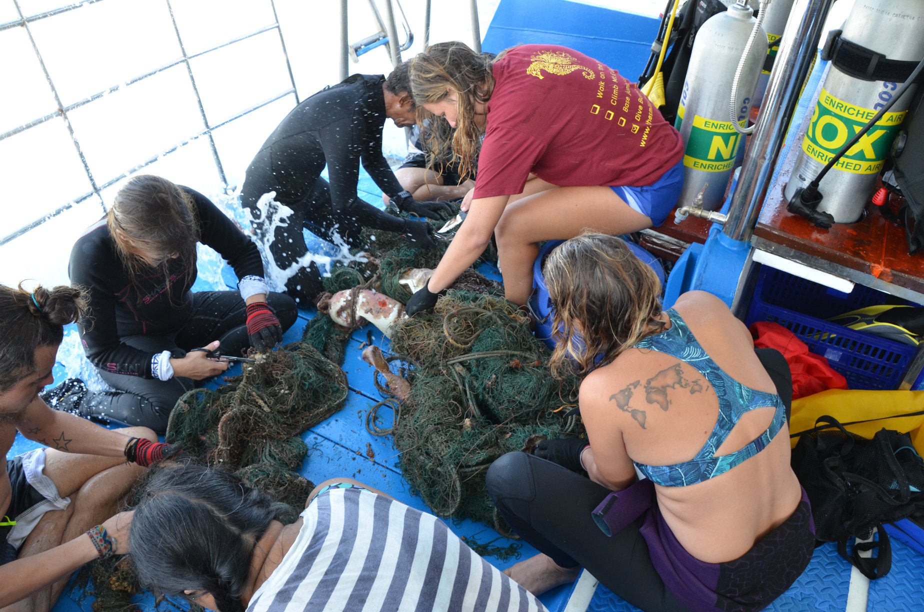 Divers gearing up on the dive deck of MV Smiling Seahorse