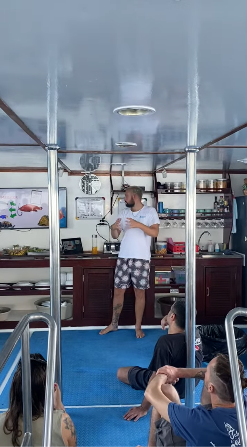 Divers on the liveaboard platform ready to jump